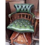 A green leather captains chair (one leg chewed by dog).