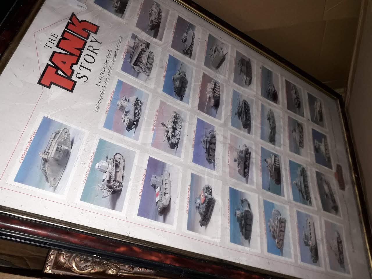 A box of pictures including a display of tank collectors cards.