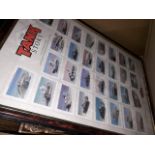 A box of pictures including a display of tank collectors cards.