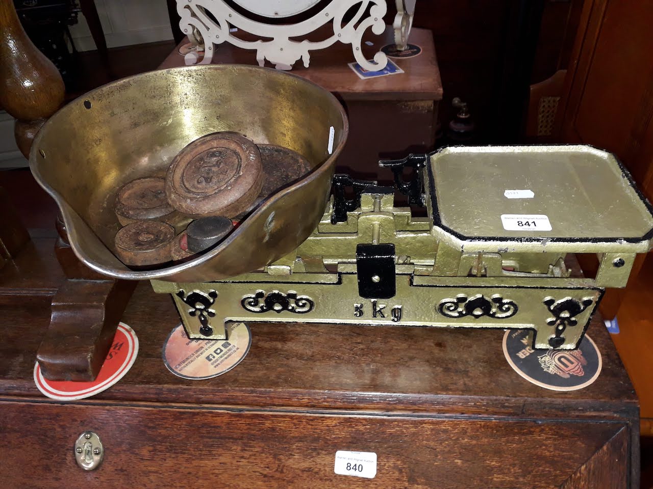 Vintage metal balance scales and weights.