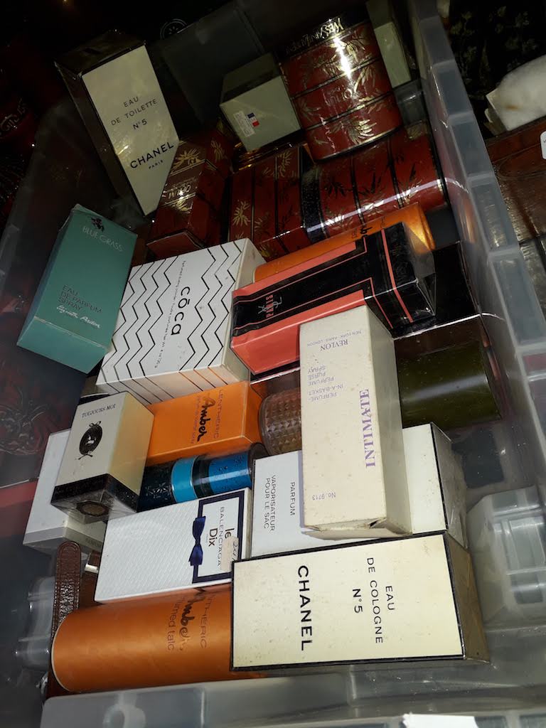 A box of vintage and modern perfumes including Chanel, Christian Dior etc.