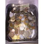 A box of world coins and banknotes