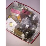 A box of world coins and banknotes