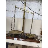 Brass and mahogany Edwardian balance scale and some weights