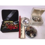 Two embroidered jewellery boxes and contents, a domed box and contents and a red cased watch