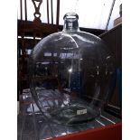 A large glass carboy.