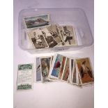 A box of cigarette cards including 'Tropical birds' by gallaher Ltd. and 'Speed Champions' by