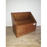 An oak stationary box with lift and slide top, length 30cm.