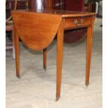 A Edwardian mahogany Pembroke table, oval top single drawer, tapered legs and brass castors.