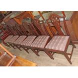 A set of six George III mahogany dining chairs with pierced splat backs, fluted legs and H frame