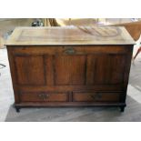 An 18th century panelled and joined oak mule chest, width 121cm, depth 52.5cm & height 79cm.