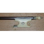 A 19th century ivory mounted violin bow, length 74cm.