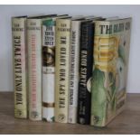 Assorted Ian Fleming titles and similar books.