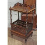 A Victorian rosewood Canterbury whatnot with fretwork gallery, turned finials, twist columns,