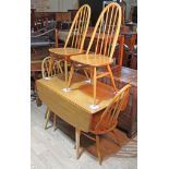 An Ercol light elm and beech drop leaf table and four chairs. Condition - table top wood join has