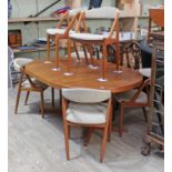 A mid 20th century Danish teak round extending dining table with X frame footed pedestal base,