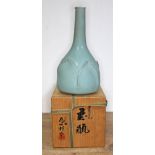 A Japanese porcelain vase, 20th century, with seal mark to base, height 27cm, with wooden box signed