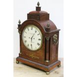 A Regency brass inlaid mahogany bracket clock, domed top with brass finials, corinthian brass