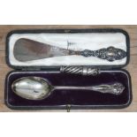 Three items of hallmarked silver comprising a cased spoon, a twist propelling pencil and a silver