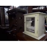 A medicine cabinet and an oak stool