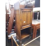 An oak bedside cupboard