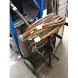 A 2 gas bottle carrier with hoses and a vintage electric heater