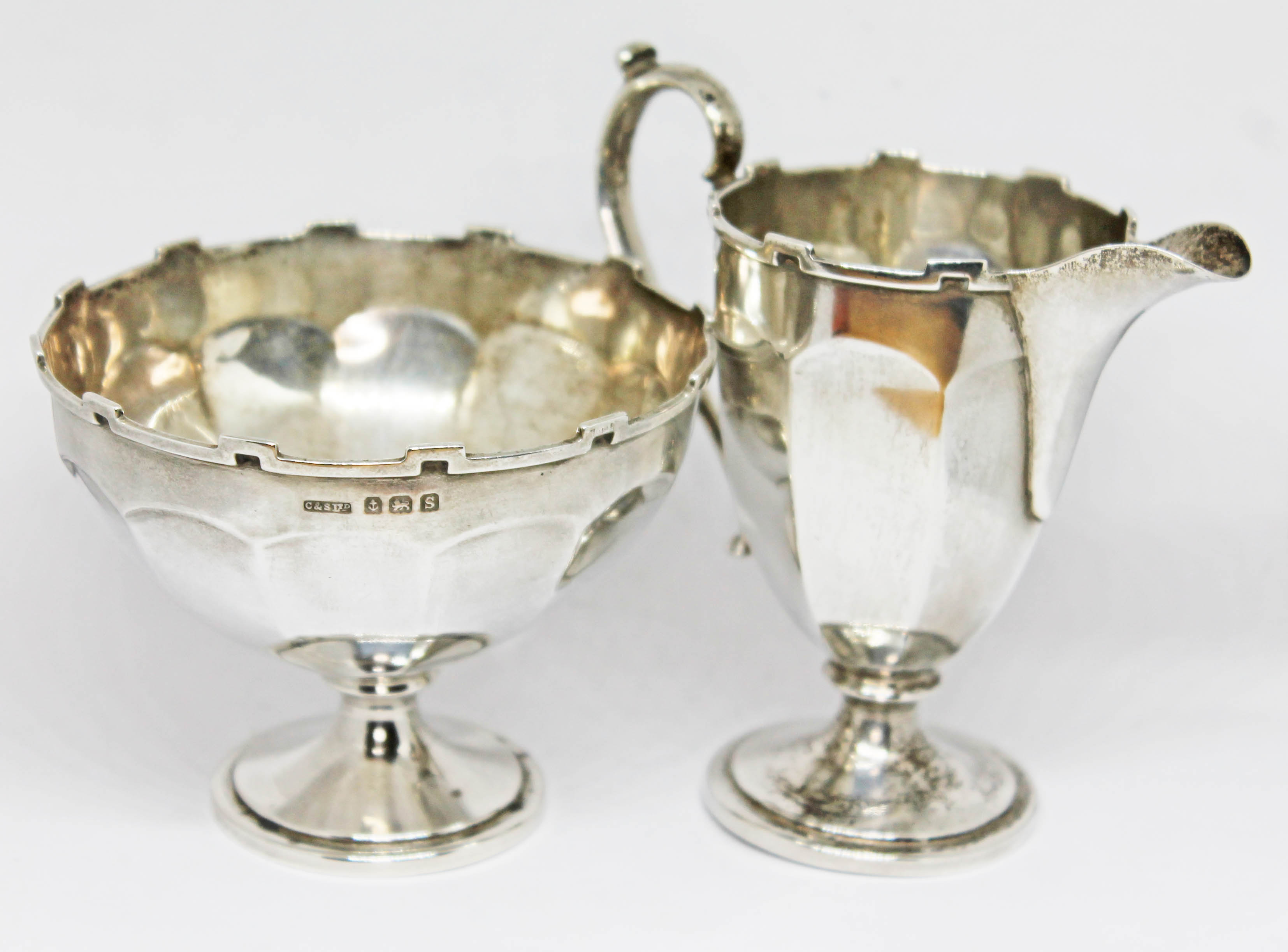 A hallmarked silver pedestal sugar bowl and matching cream jug, weight 4 1/2oz. Condition - marks