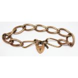 An early 20th century link bracelet with heart shaped clasp, marked '9ct', gross weight 11.89g,