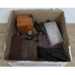 A box containing microscope books, two boxed microscopes, a bakelite microscope and various slide