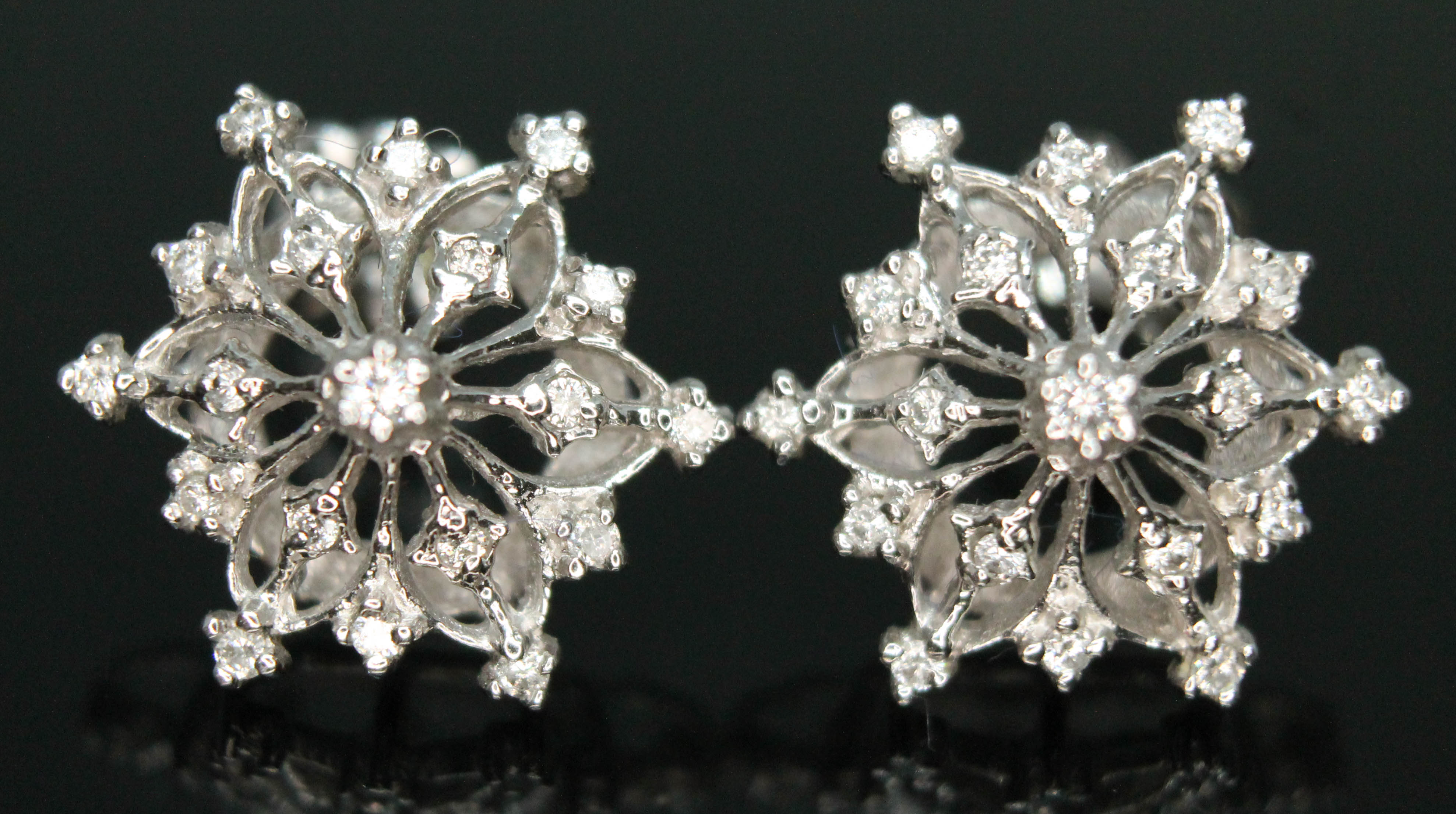 A pair of diamond earrings of snowflake form by Franklin Mint, possible designed by Stuart Devlin,