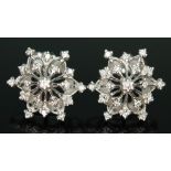 A pair of diamond earrings of snowflake form by Franklin Mint, possible designed by Stuart Devlin,