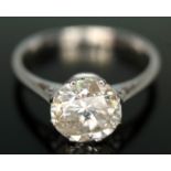 A diamond solitaire ring, early 20th century, the eight claw set slight oval brilliant cut diamond