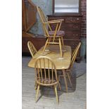 An Ercol blonde elm drop leaf table and four chairs. Condition - marks to table top otherwise fine.