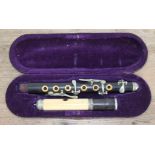 A late 19th century nickel mounted ivory and rosewood piccolo with case. Condition - crack to