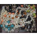 A box of assorted costume jewellery including an Art Deco style pressed glass beaded two strand