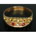 An early 20th century diamond and garnet ring, hallmarked 18ct gold, sponsor's mark 'F.H.L.',