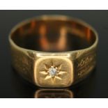 A gent's hallmarked 18ct gold ring set with a diamond, gross wt. 4.98g, size U. Condition - band