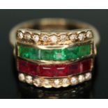 A diamond, ruby and emerald four row ring, head measuring approx. 17mm x 13mm, band marked '18k',