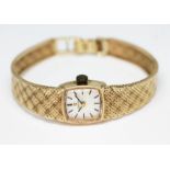 A 1972 hallmarked 9ct gold Omega ladies wristwatch having signed silvered dial with hour and hand