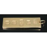 A hallmarked 9ct gold ingot, wt. 15.34g, length 43mm. Condition - ding to reverse, general wear.