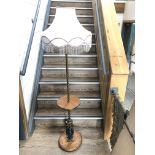 A turned brass and oak smokers lamp having twist brass stem, round oak center table above a scrolled