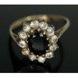 A hallmarked 9ct gold sapphire and CZ cluster ring, gross wt. 2.25g, size N. Condition - a build