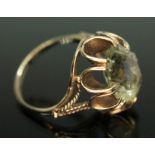 A hallmarked 9ct gold ring set with an oval cut citrine, gross wt. 4.60g, size N. Condition -