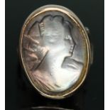 A mother of pearl doublet cameo ring, band unmarked, gross wt. 5.65g, size M. Condition - part of