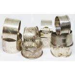 A group of nine hallmarked silver serviette rings including two pairs, gross weight 7 3/4oz.