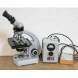 A Carl Zeiss electric microscope with additional slides and transformer.