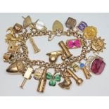 A hallmarked 9ct gold charm bracelet, various charms including Blackpool tower, a church, a bottle