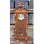 A large late 19th century double weight driven walnut Vienna wall clock by Gustav Becker, length