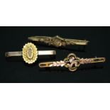 A group of three bar brooches, one set with a split pearl and two small diamonds, all marked '