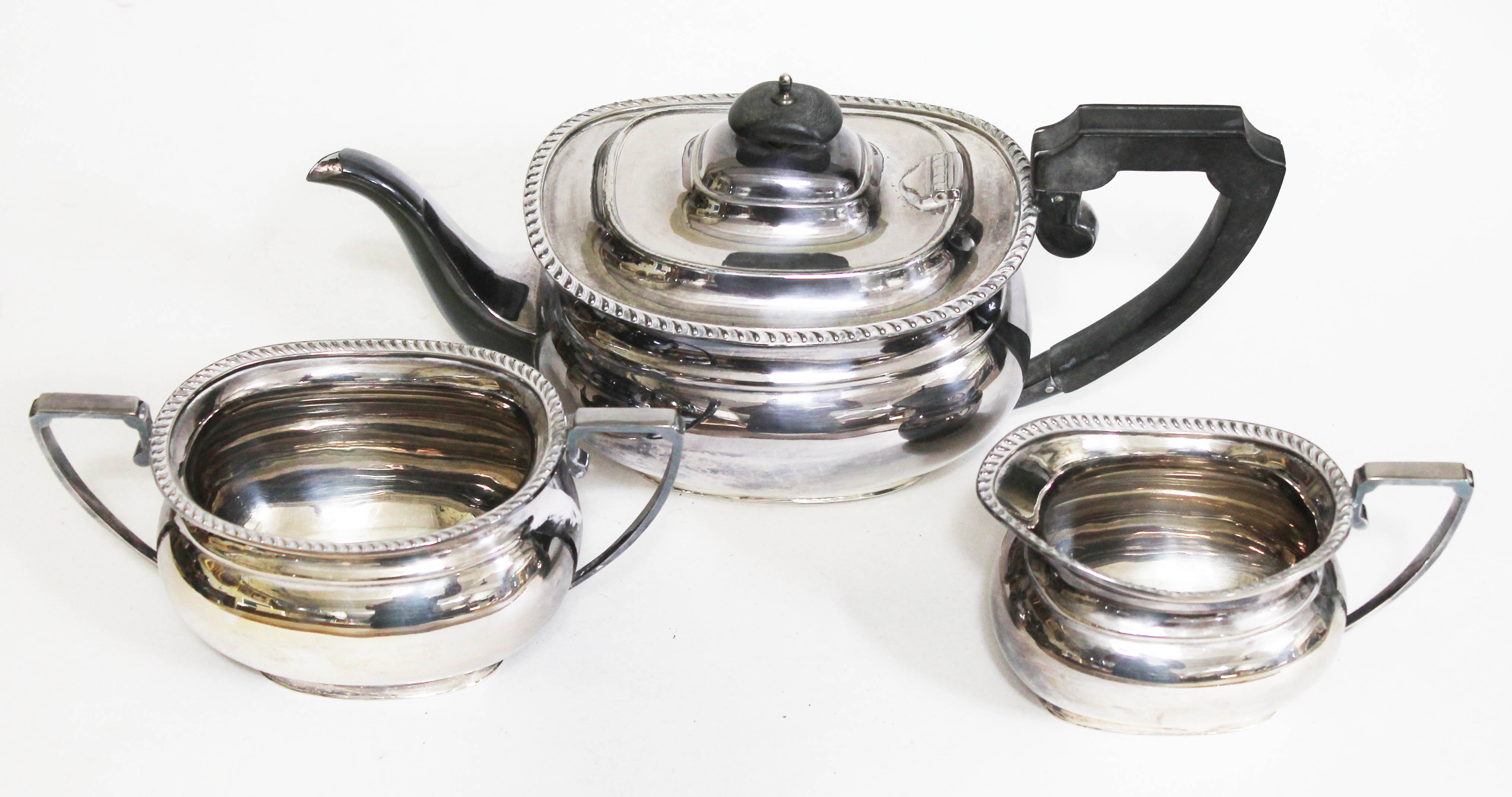 A three piece hallmarked silver tea set, gross weight 43oz.
